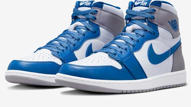 View of blue, white, and grey Air Jordan shoes.